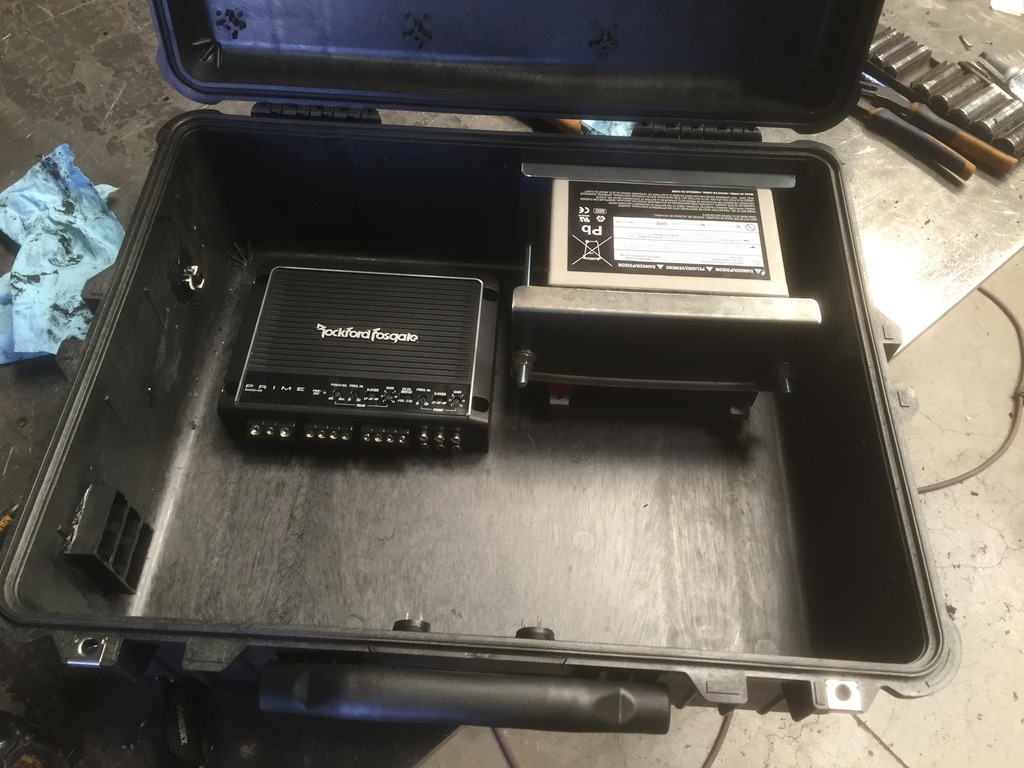 Rockford Fosgate Prime amp and AGM battery in custom welded steel cradle inside Pelican case