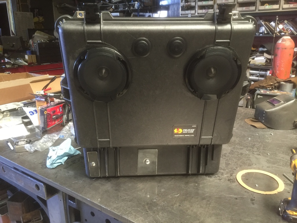 Finished Pelican 1600 boom box with Alpine speakers and tweeters mounted on welding bench
