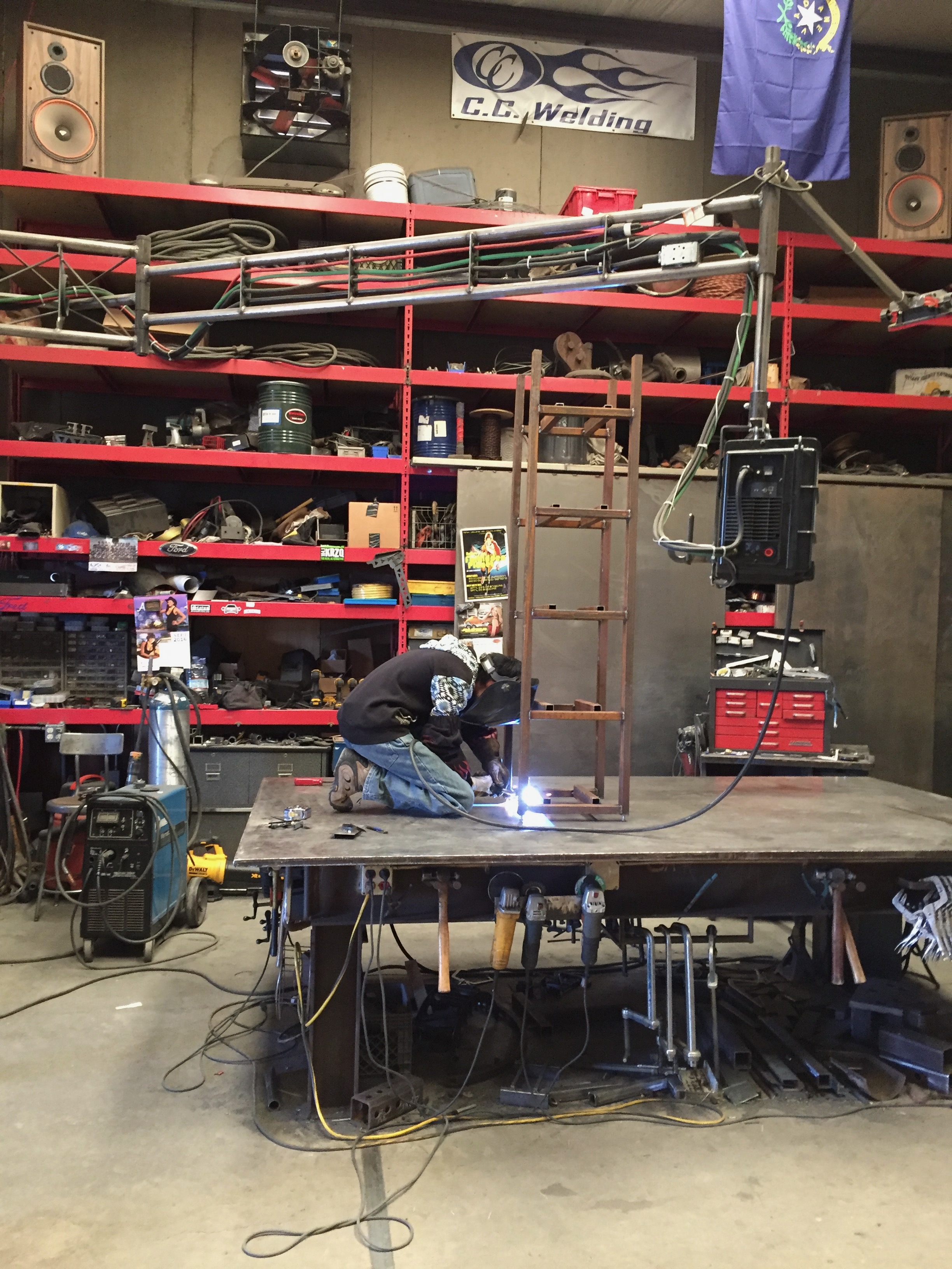 Craig Caddy actively welding with visible arc