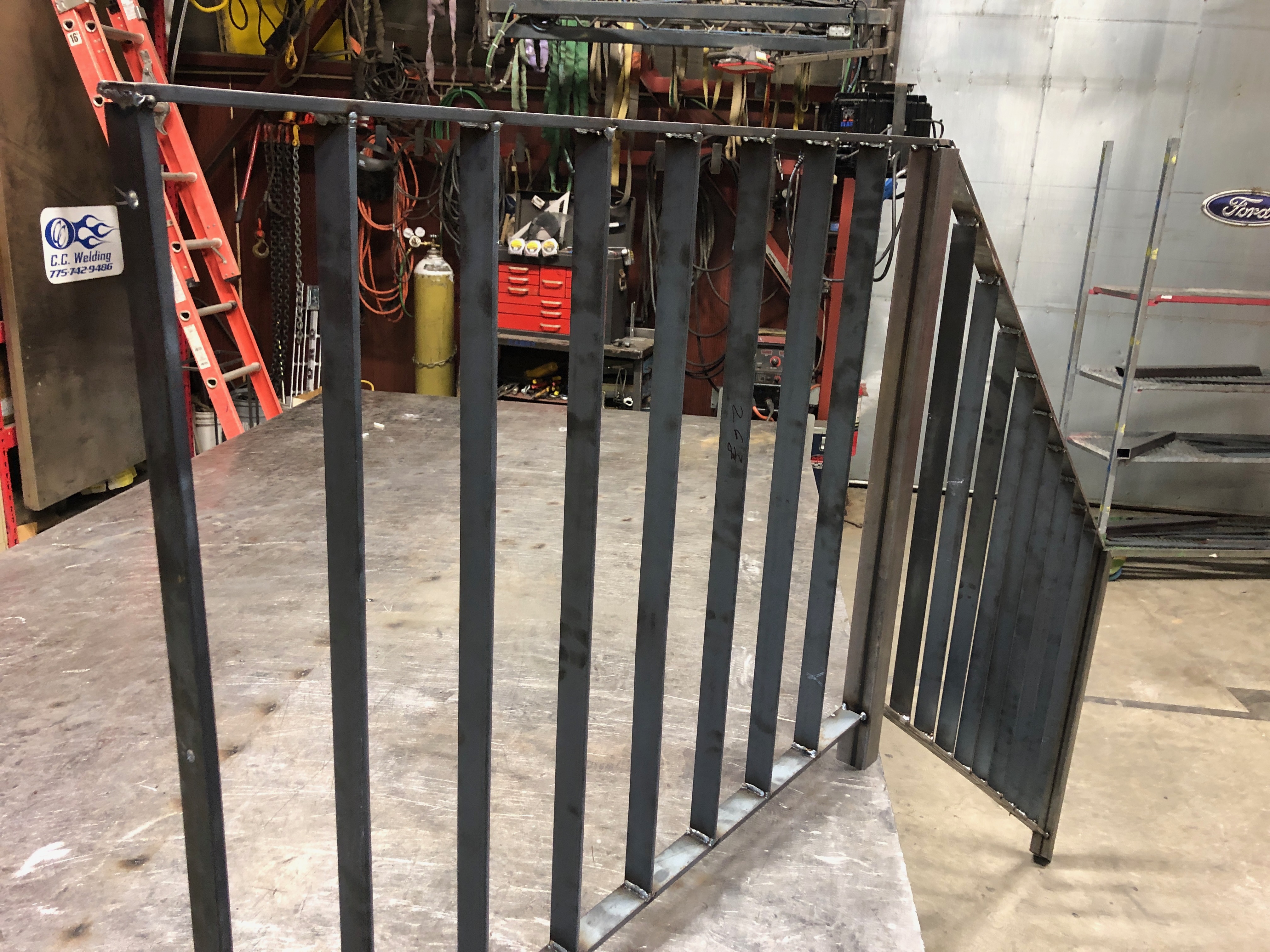 Steel gate panel with vertical bars